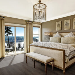 Luxury bedroom interior with rich furniture and scenic view from walkout deck